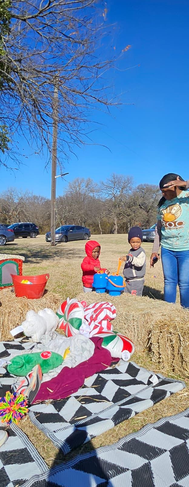 Children playing among hay bales and holiday decor