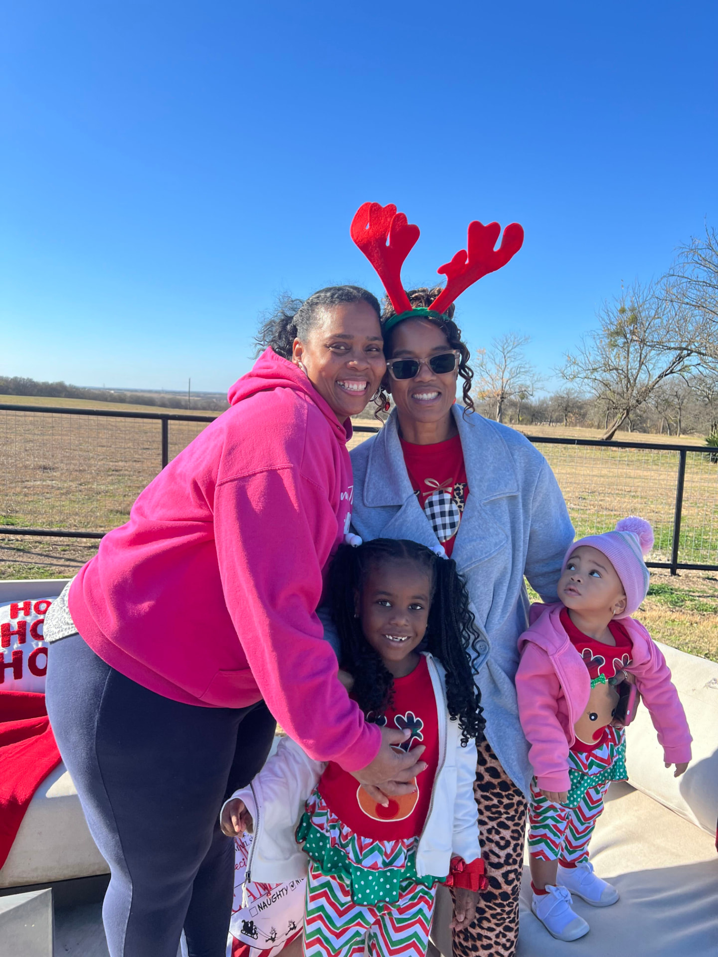 Tara with guests in reindeer antlers and holiday outfits